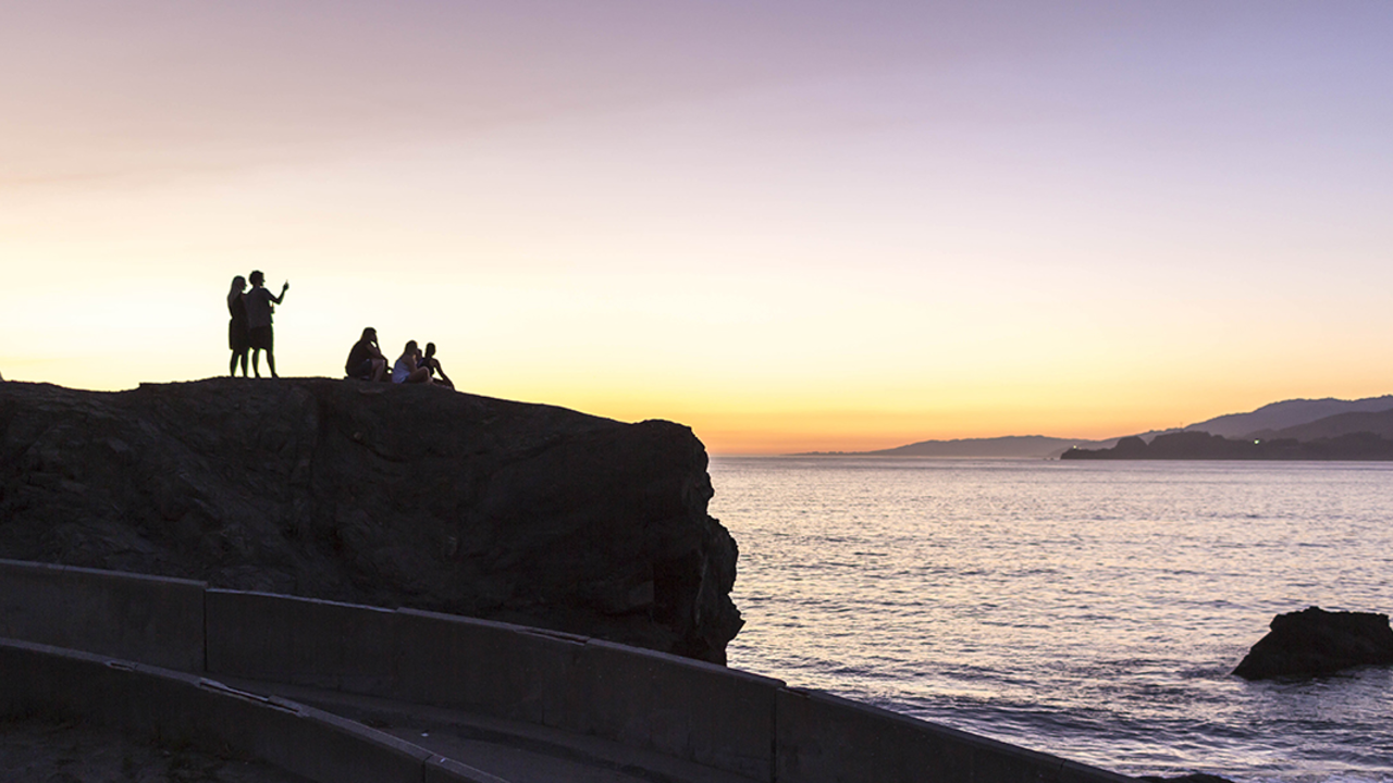 People enjoying the sunset from China Beach