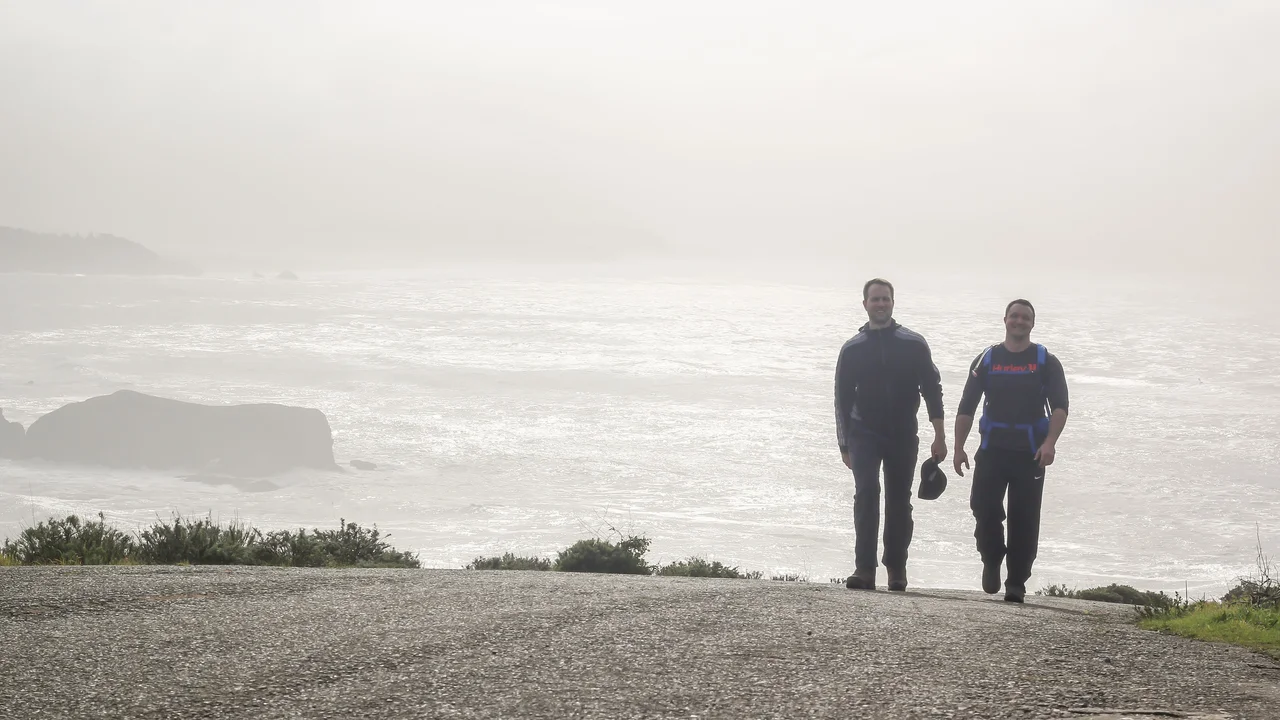 Visitors hike up the Coastal Trail from Rodeo Beach