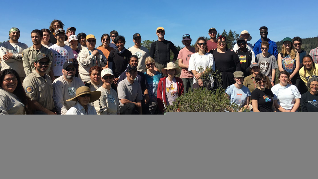 Amah-Mutsun-Tribal-Band_1200x600.jpg A large group of volunteers poses outside on a sunny day