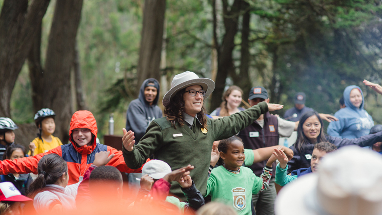 Summer Camp Campfire National Park Service Ranger with Summer Campers