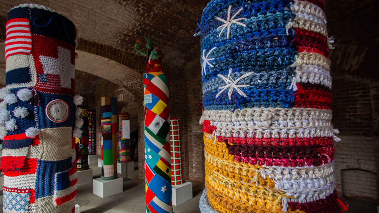 Pole surrounded by a knitted American flag at Fort Point National Historic Site