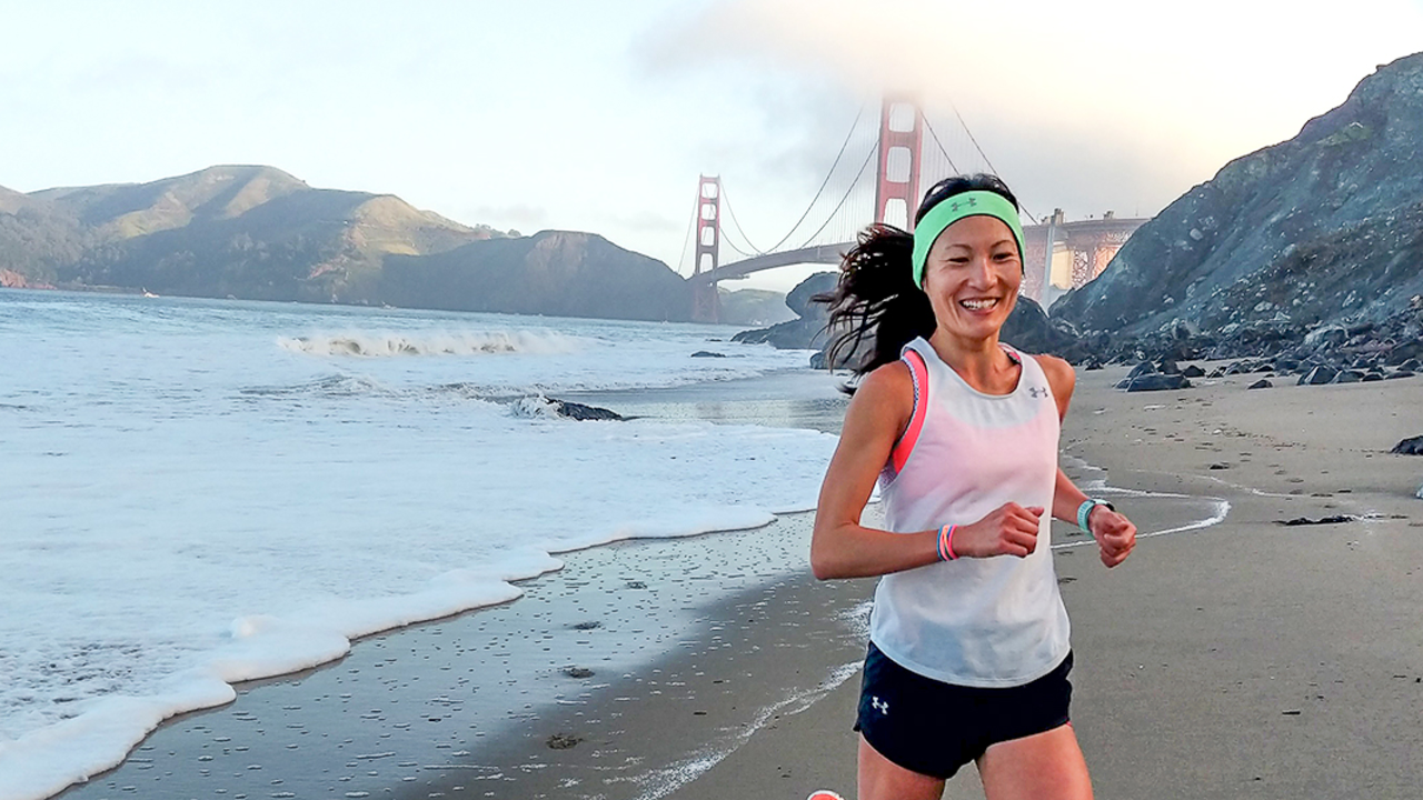 YiOu Wang running at Baker Beach