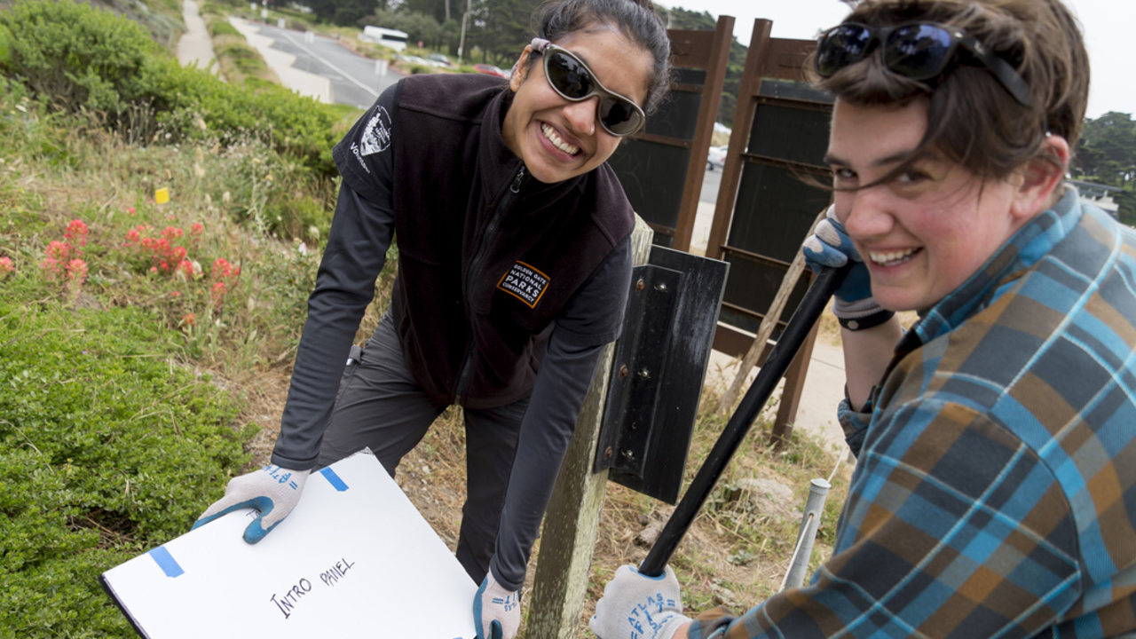 Parks Conservancy staff working on the installation of the StoryWalk at Lands End