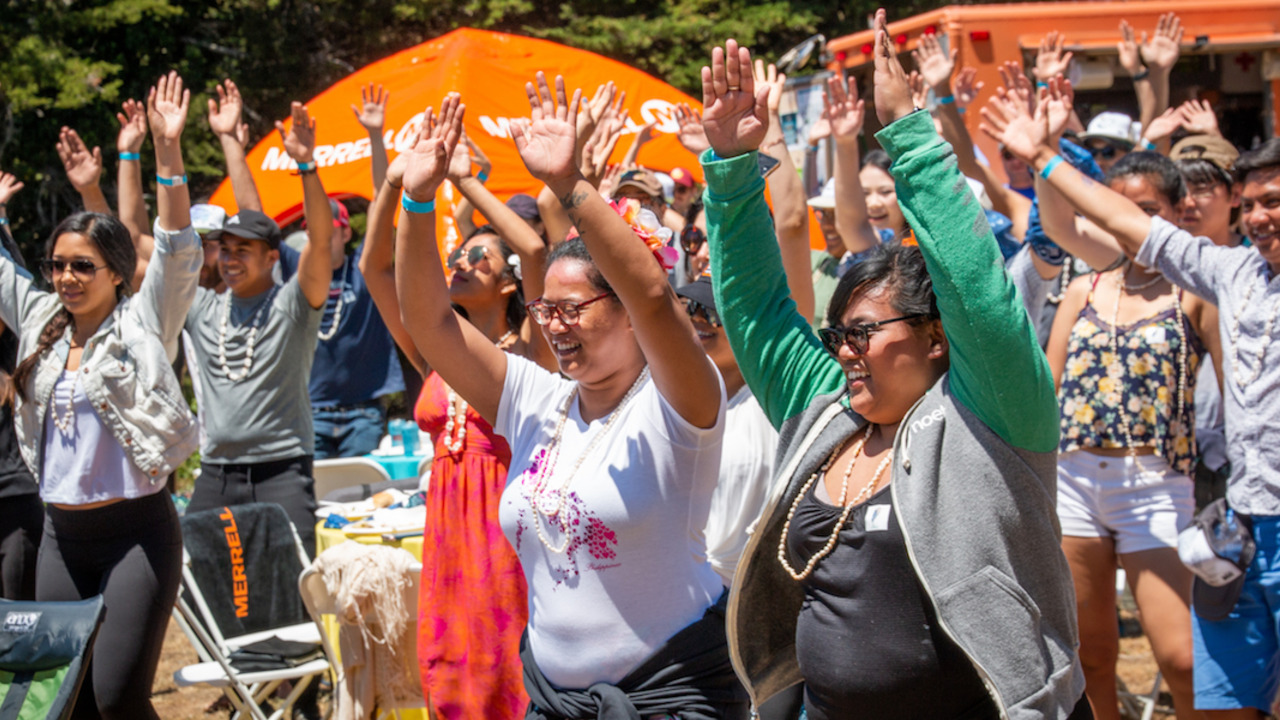 Hands in the air at the Give Back Kick Back