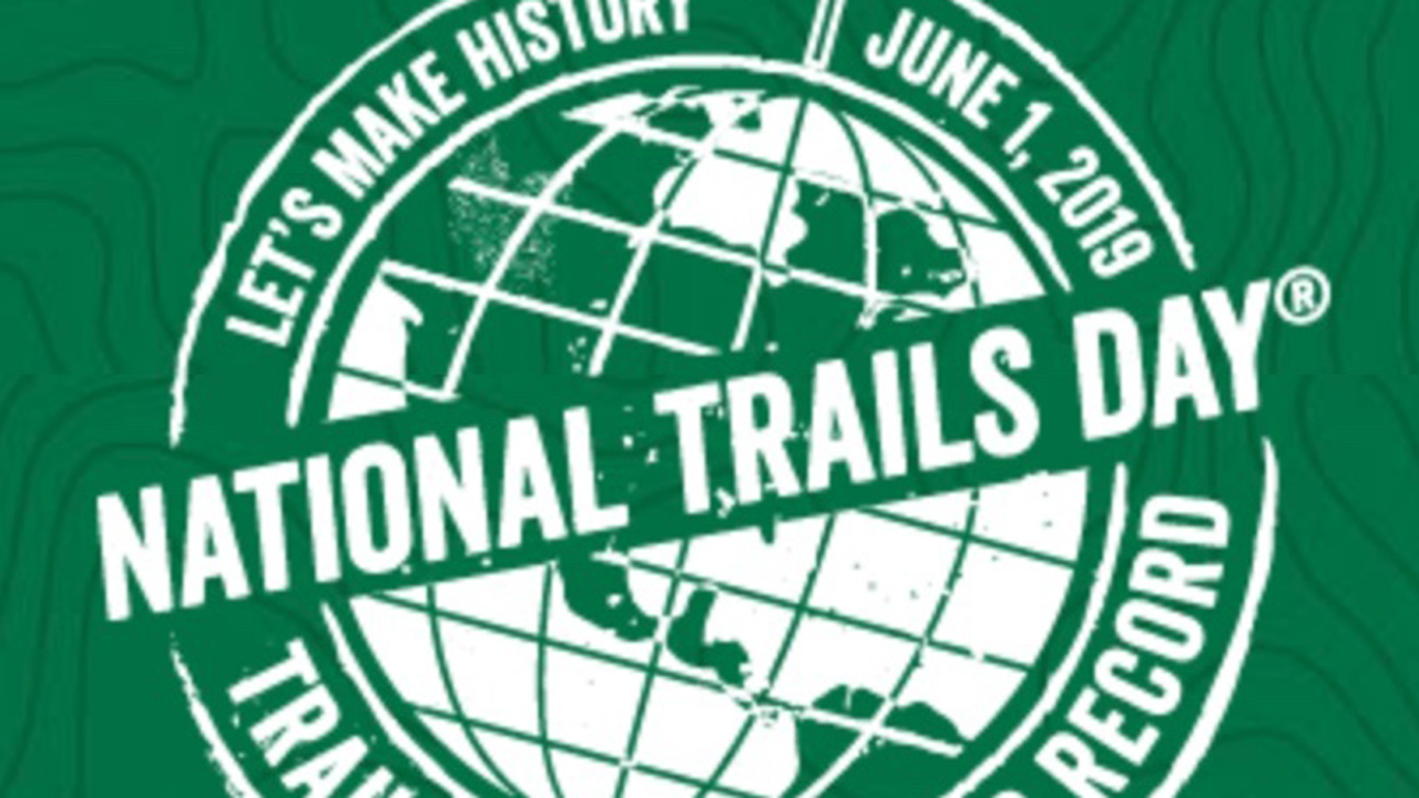 National_Trails_Day_badge_1200x600.jpg A design element of a planet with words encircling it
