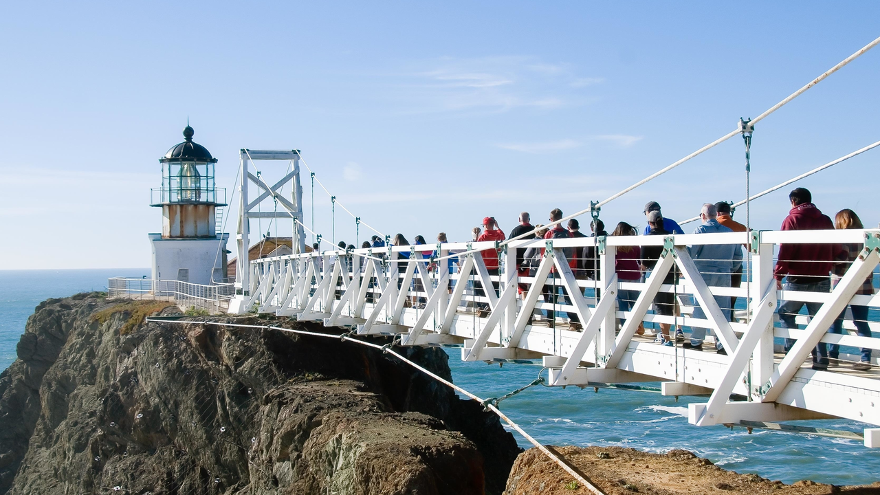 Visitors cross the bridge to Point Bonita Light Visitors cross the bridge to Point Bonita Light