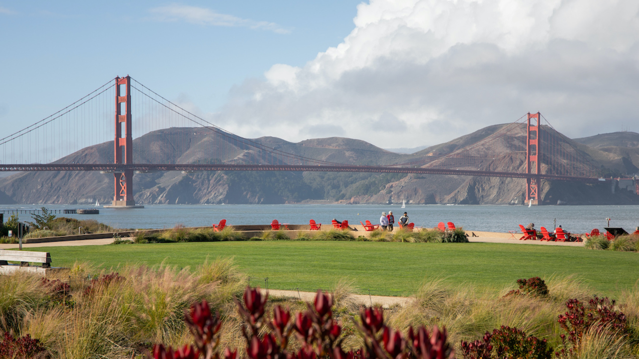 Golden Gate Bridge in background with Presidio Tunnel Tops in foreground.