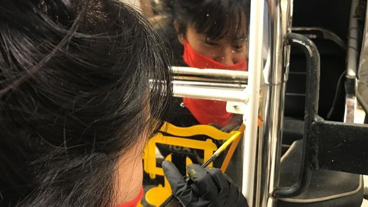 Artist Meng Nguyen painting TNT
