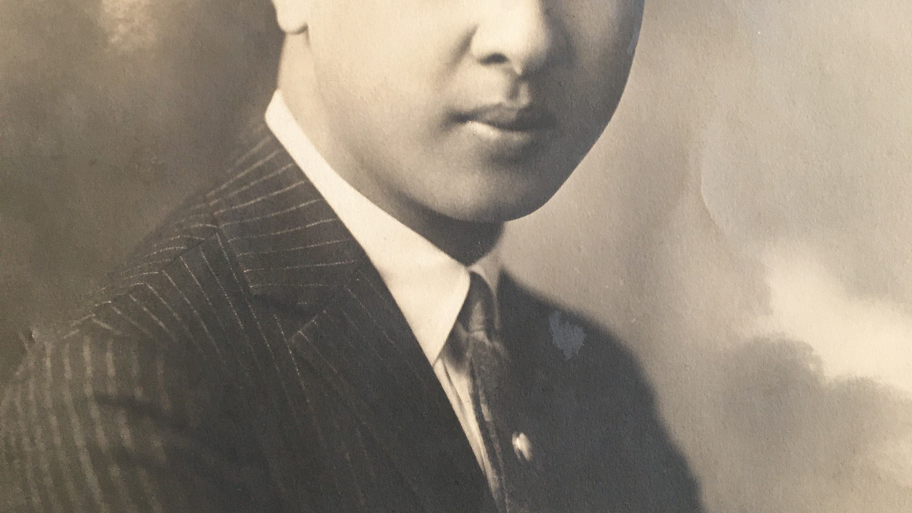 A sepia toned photograph from 1923 of Wallace Fong, a young Chinese-American man.