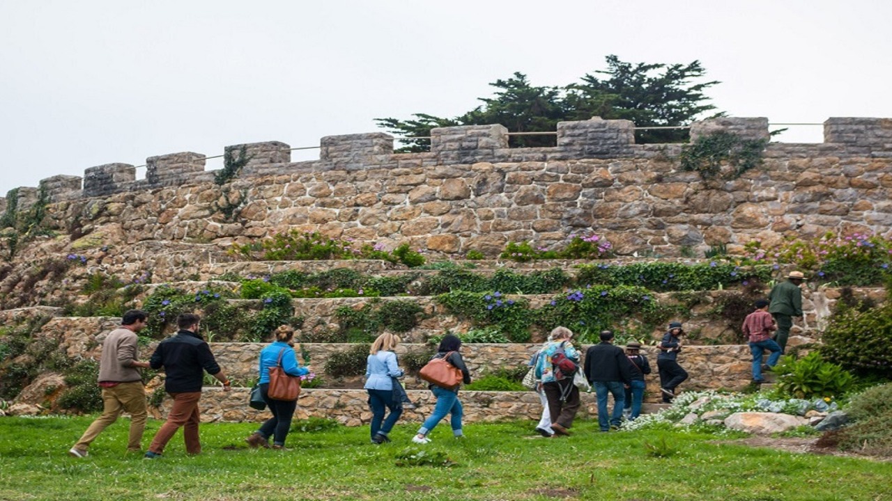 Group of hikers being guided by a Park Ranger