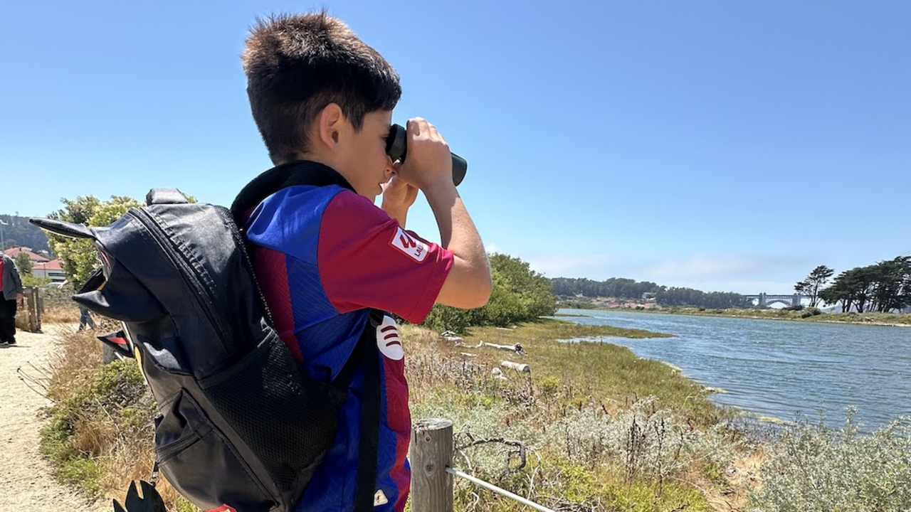 IMG_4688_2x1.jpeg Kid with binoculars staring at Crissy Field Marsh.