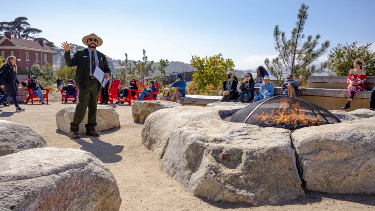 NPS Park Ranger gives a presentation to visitors at the Presidio Campfire Circle