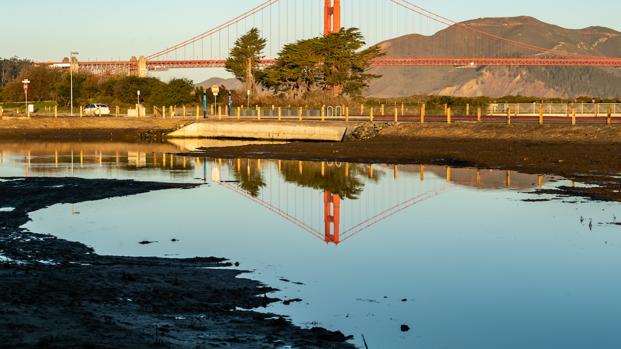 Golden Gate Bridge reflecting in Quartermaster Reach saltwater marsh Golden Gate Bridge reflecting in Quartermaster Reach saltwater marsh