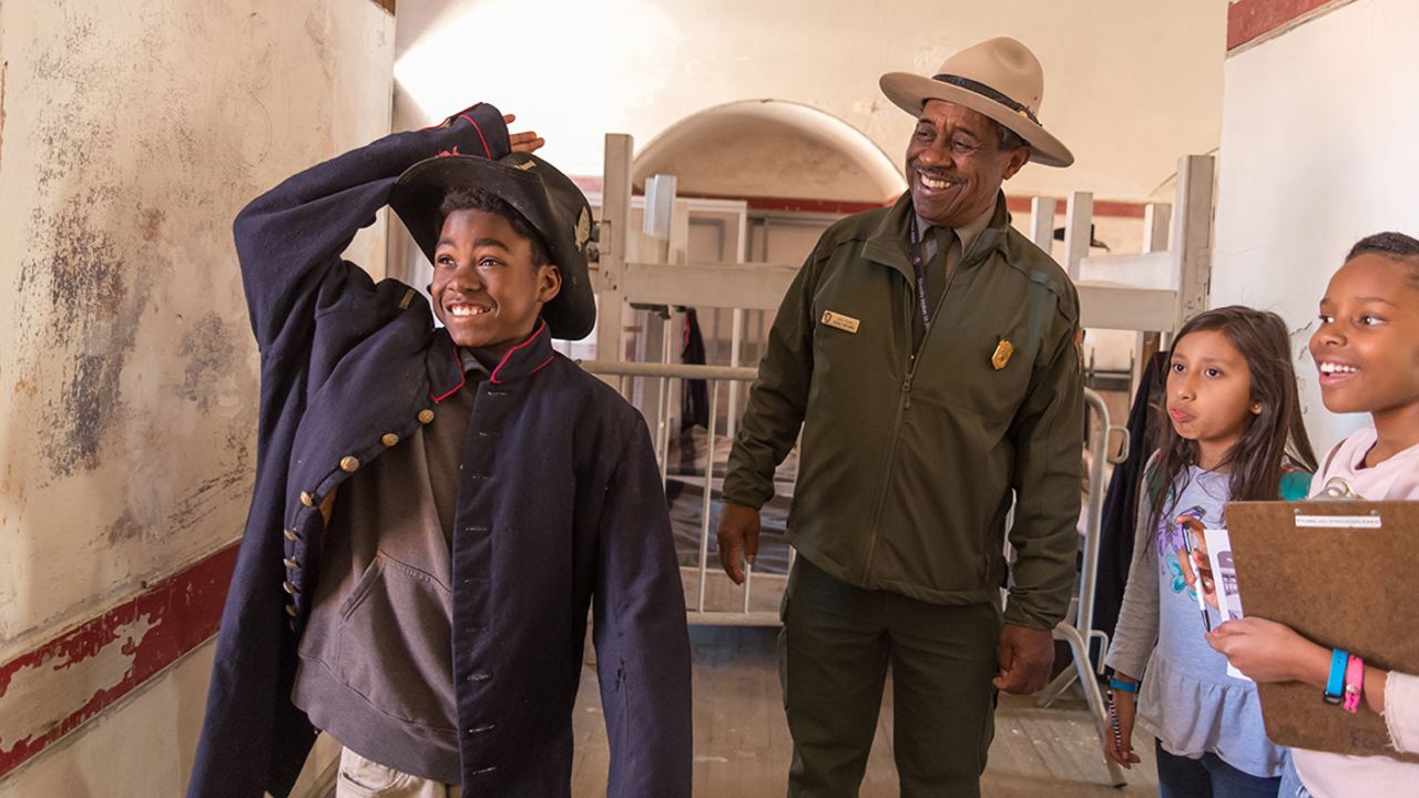 Ranger Rik Penn leads a program with youth at Fort Point in March 2018.