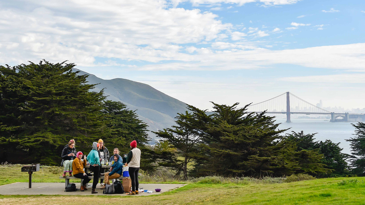People picnic at Battery Wallace in Marin with Golden Gate Bridge views