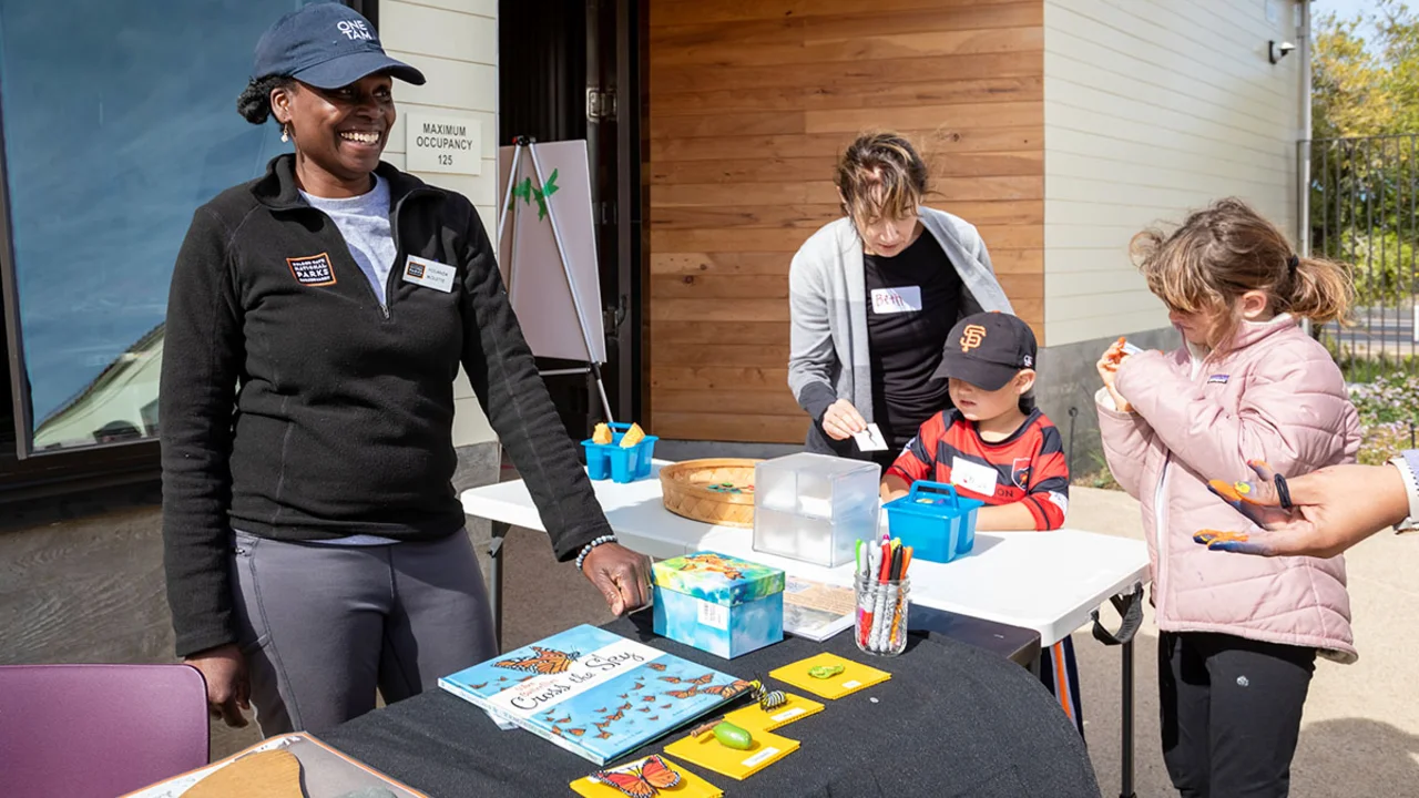 Yolanda Molette connects with participants at a workshop featuring butterfly migration.