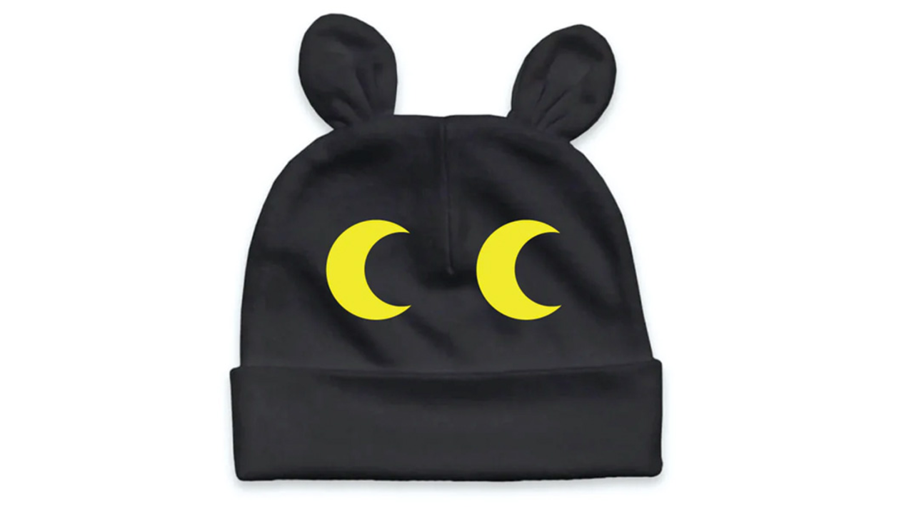 Black and yellow infant cap with animal eyes.