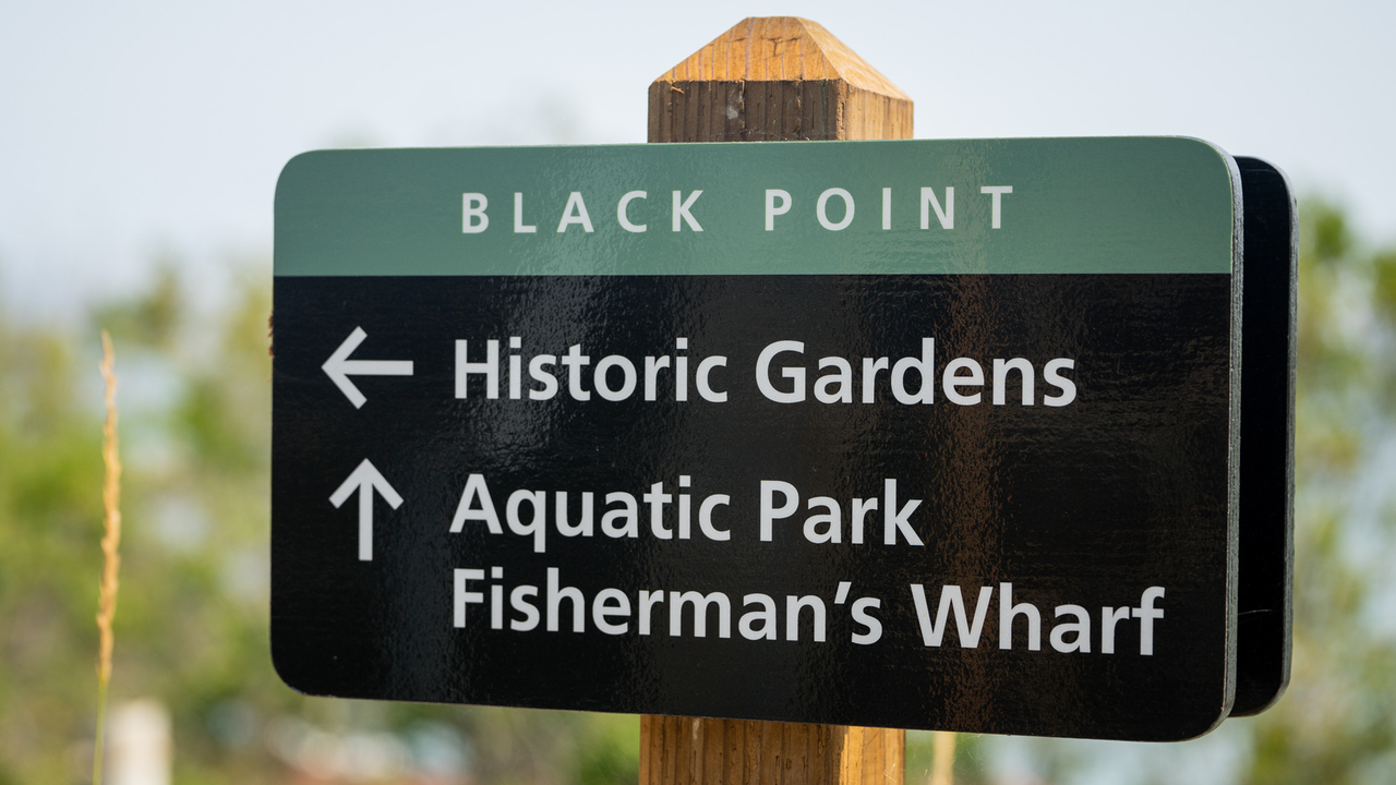 Sign that shows directions for Black Point Historic Gardens and Aquatic Park