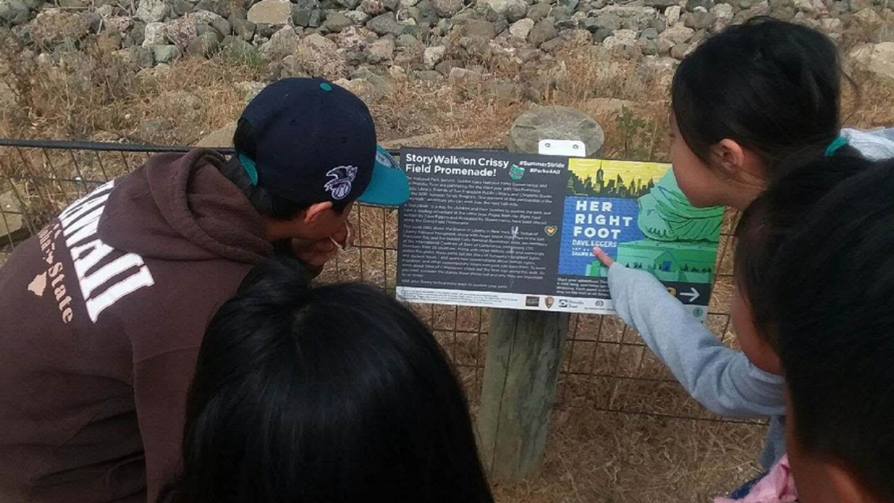 children looking at a storyboard and pointing