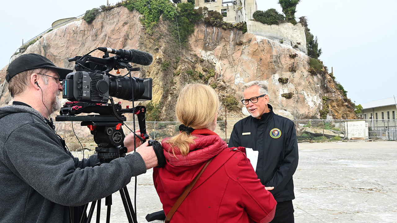 John Cantwell talks to reporters on Alcatraz Island.