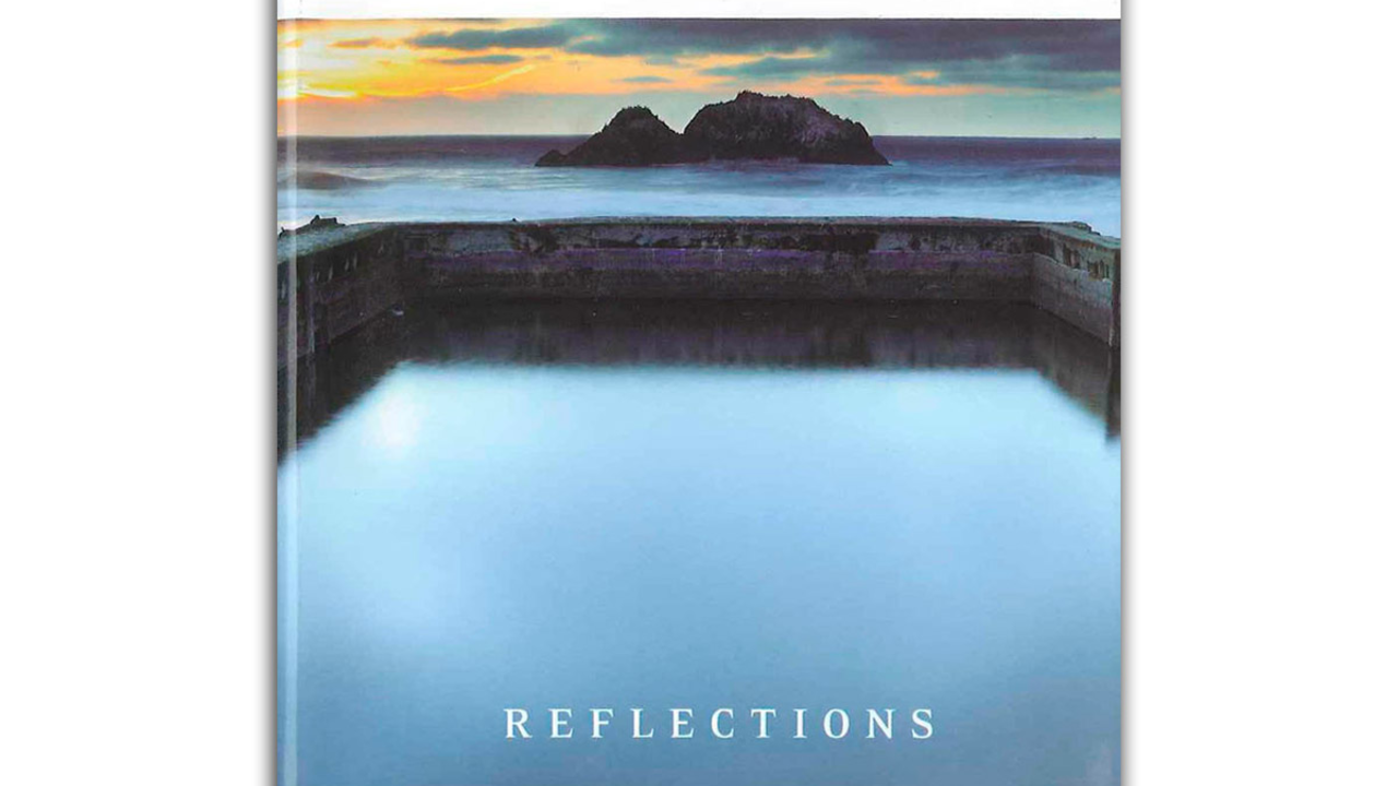 Cover of "Lands End Reflections" book, featuring a Sutro Baths sunset photo.