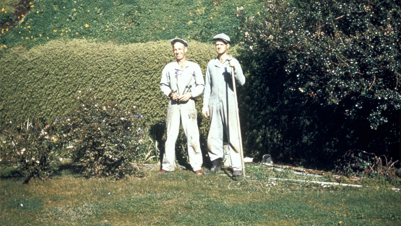 Two Alcatraz inmates standing in the garden