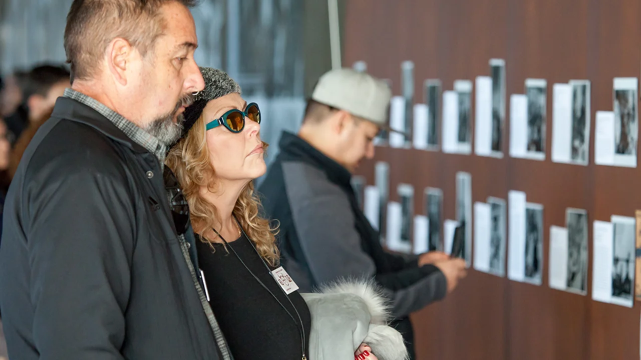 people look at art on walls