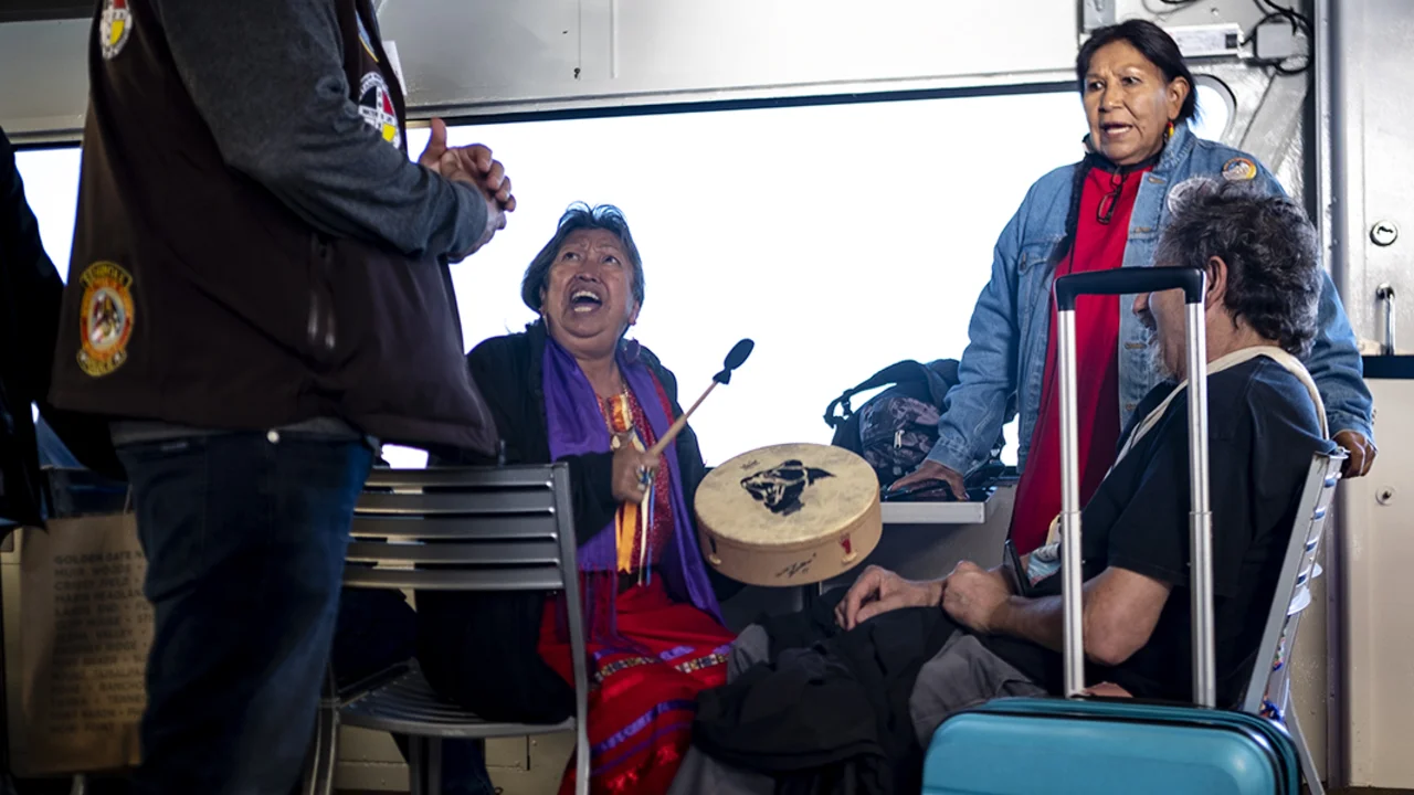 people sing and play drums