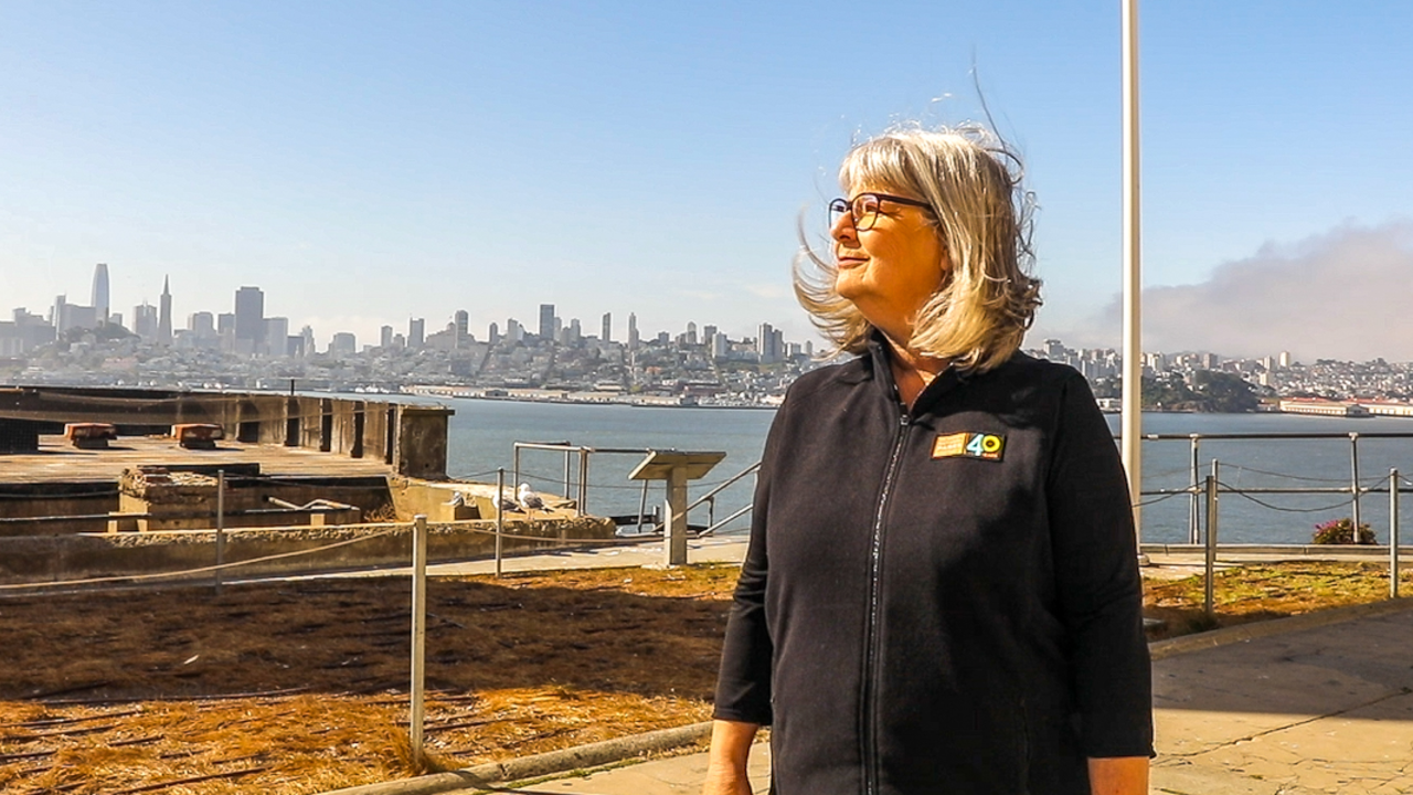 Nicki Phelps, JVM Award recipient, at Alcatraz Portrait of Parks Conservancy staff member Nicki Phelps on Alcatraz Island with the San Francisco skyline backdrop
