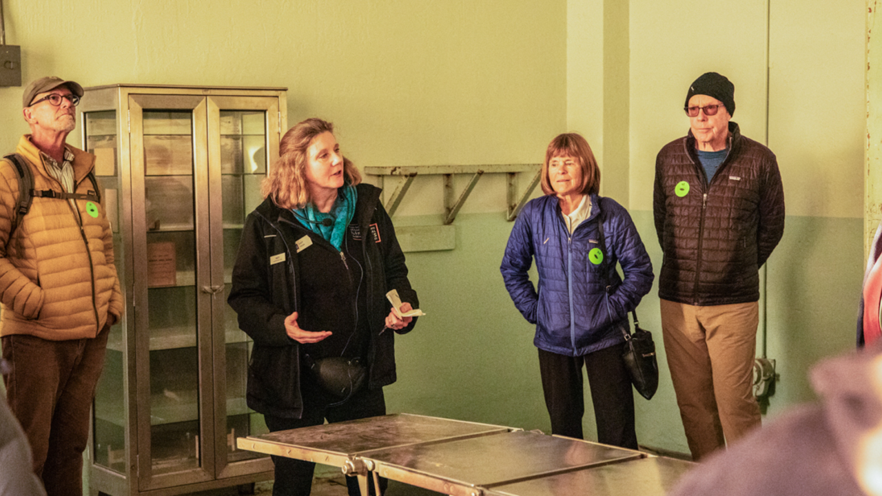 Alcatraz Behind the Scenes Tour A guide leads a tour group through the medical wing during a behind-the-scenes tour at Alcatraz Island