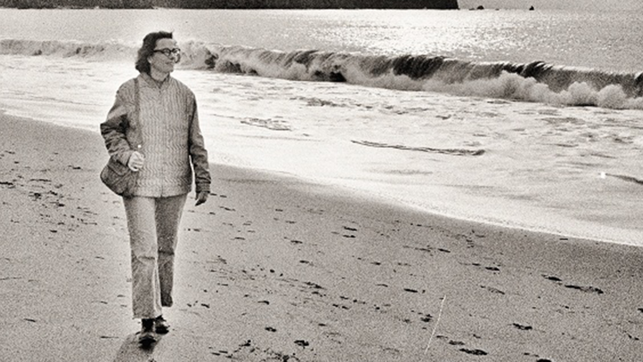 Amy Meyer walking on Baker Beach, 1973