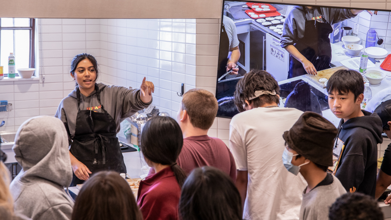 Crissy Field Center youth program participants gather in the learning kitchen.
