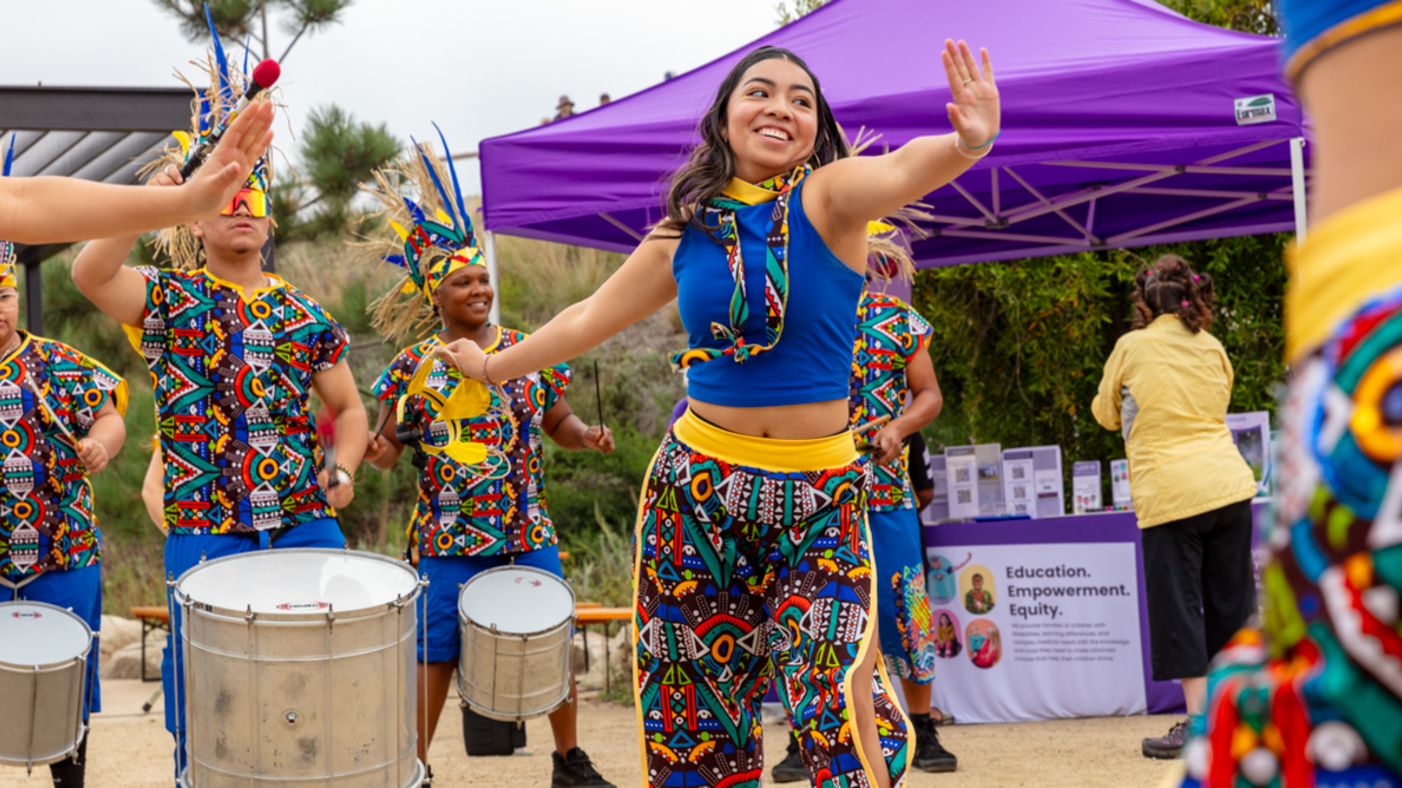 Fogo Na Roupa performing for Access to Adventure Colorfully dressed Fogo Na Roupa dancers and band performing at the Presidio Tunnel Tops