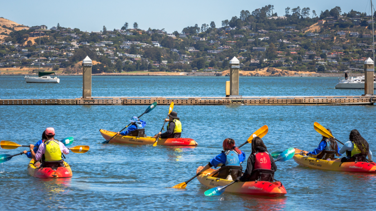 Urban Trailblazers paddle out in 2024 Kayaking youths paddle out from the harbor in Sausalito as part of the Urban Trailblazers program