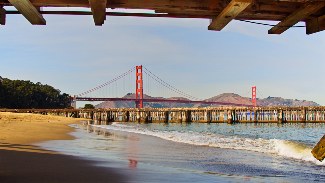 Golden Gate Bridge viewed from Crissy Field East Beach A view of the Golden Gate Bridge from beneath the pier of Crissy Field East Beach.