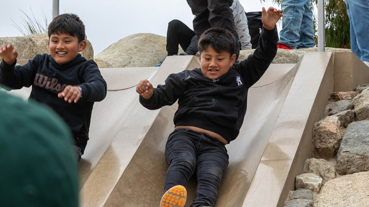 Participants from ALAS (Ayundando Latinos A Soñar) enjoying the "Raíces en la Bahía/Rooted in the Bay" event for farmworkers and their families in September 2024. Activities included crabbing, hiking, and beachside recreation.