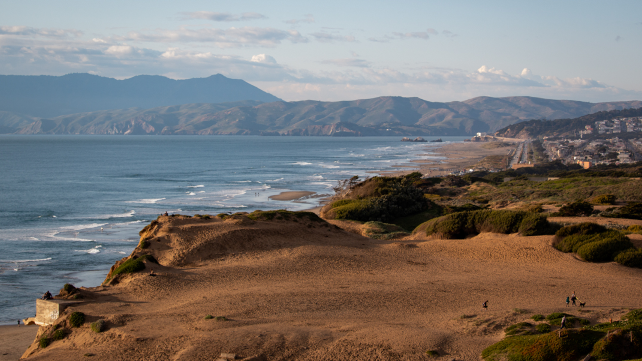 Fort Funston from high up above An aerial view of Fort Funston shows the ocean, beach, cliffsides, and looks on to the golden gate.