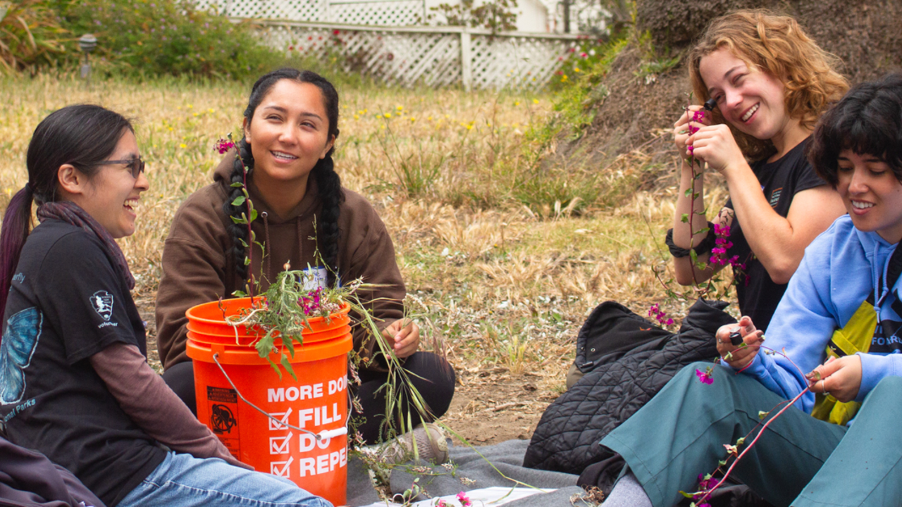 Academic Interns smiling and enjoying the task of identifying native plant species.