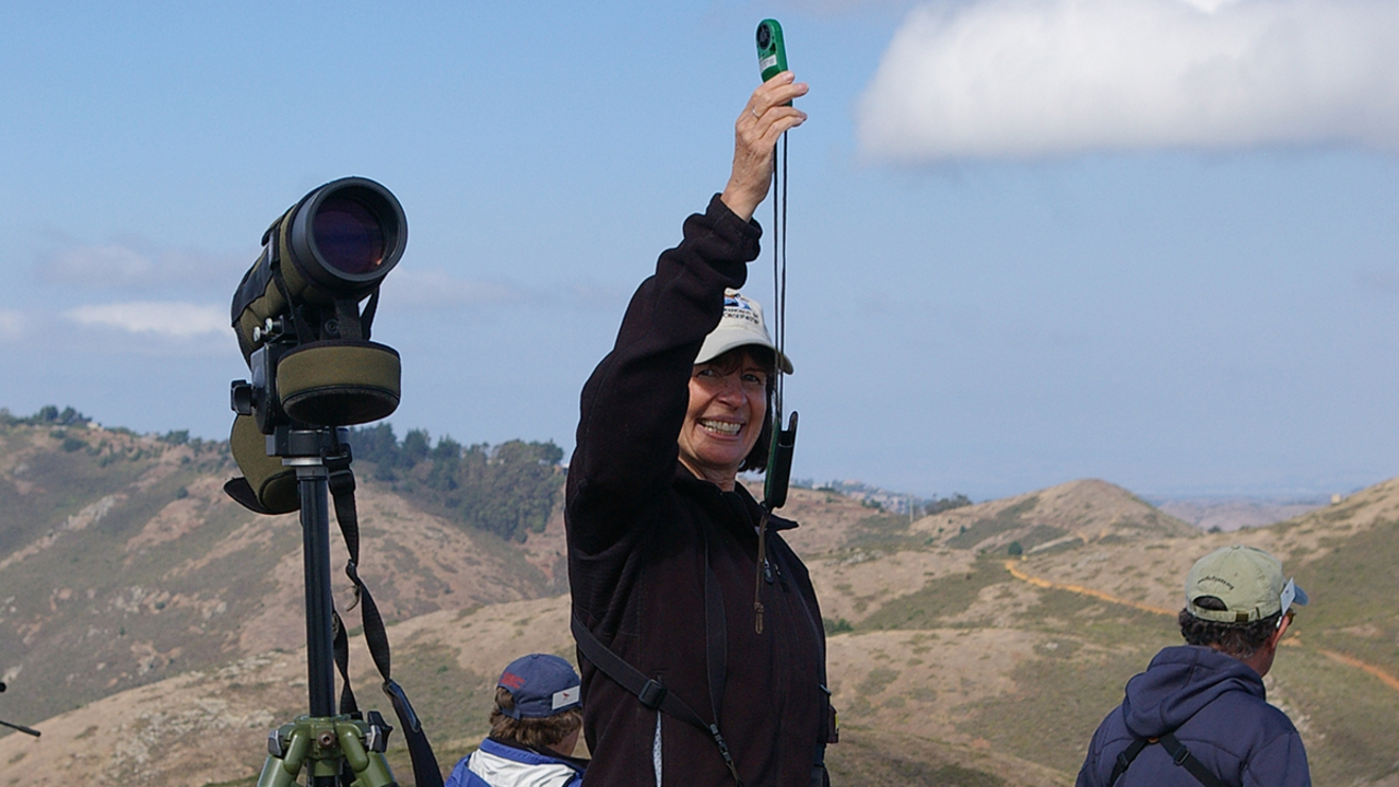JohnOdell_IMGP4160_3x2.jpg Hawkwatcher Caryl Carr measures the wind