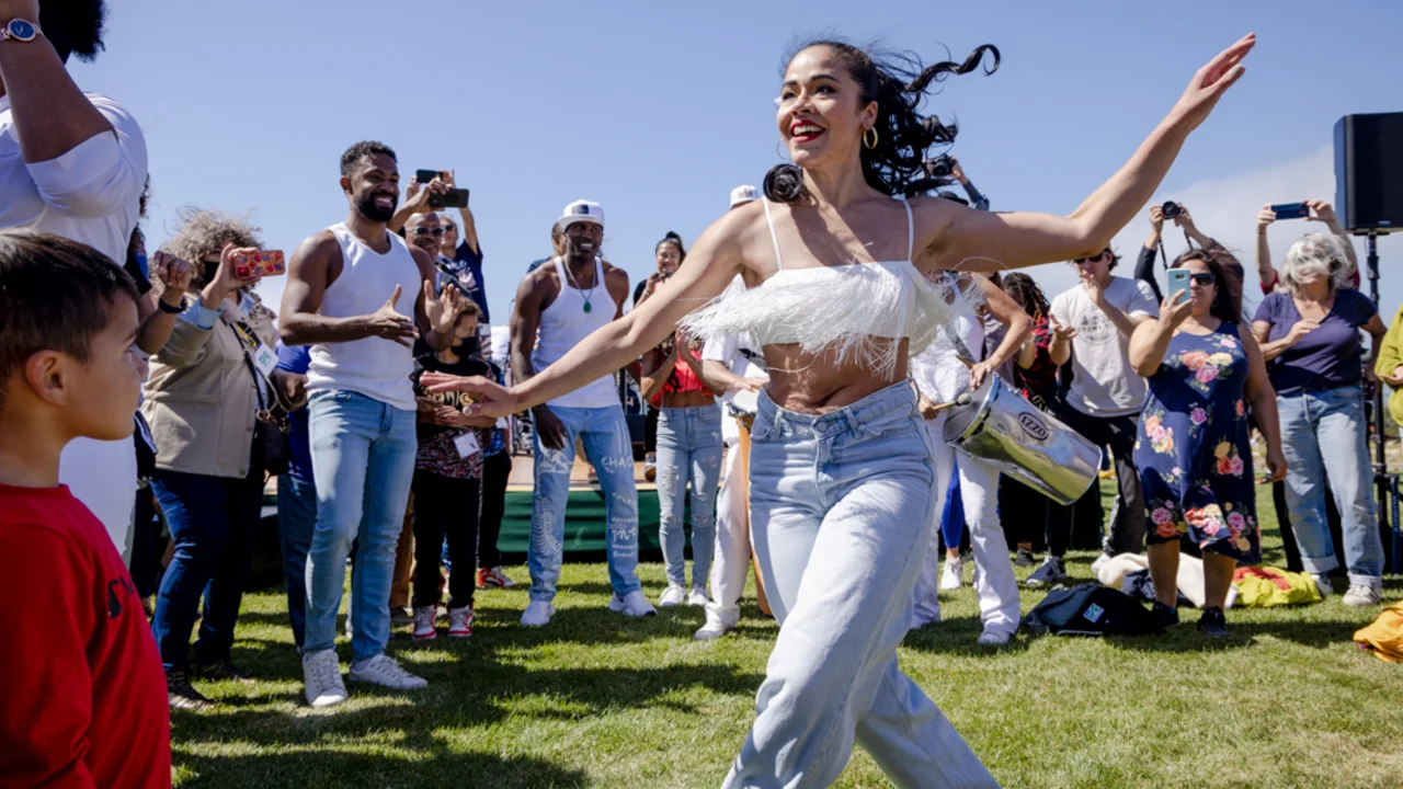 A dancer dances amongst the crowd at the Presidio Tunnel Tops.