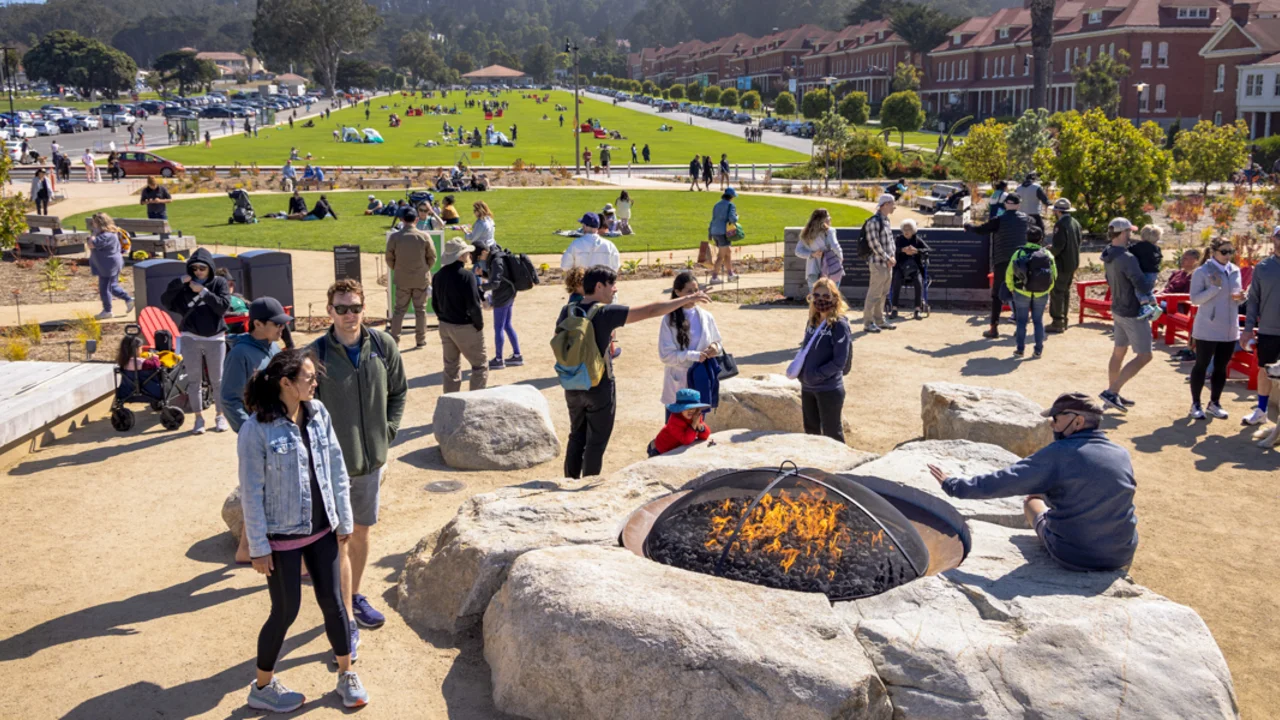 A crowd gathers around the Campfire Circle at the newly opened Presidio Tunnel Tops.