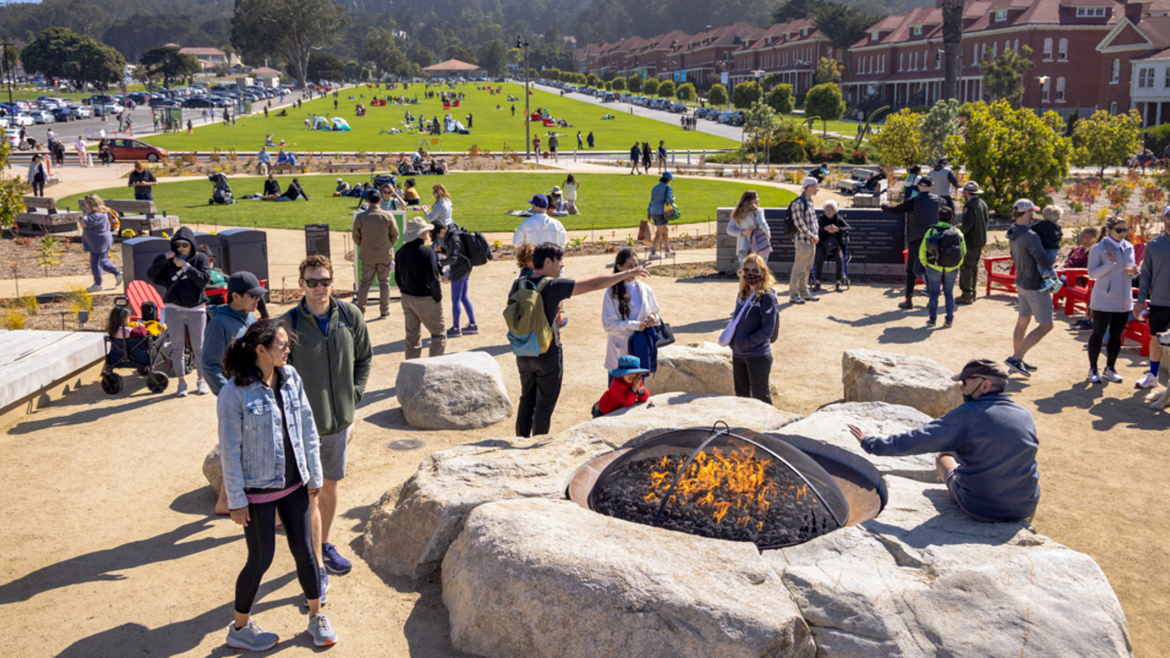 A crowd gathers around the Campfire Circle at the newly opened Presidio Tunnel Tops.