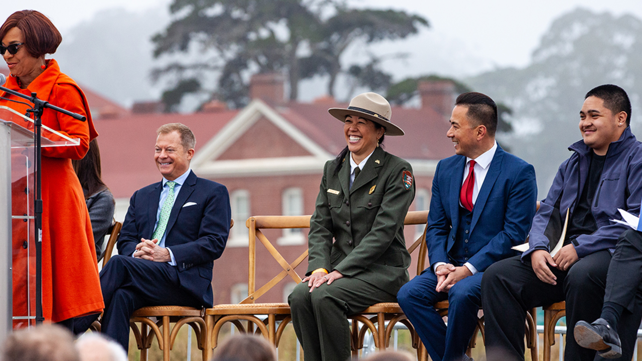 Speakers on a stage at the Presidio.