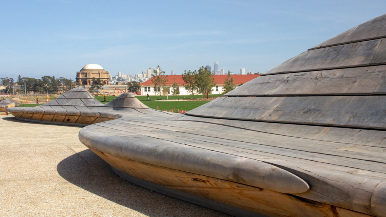 A view of The Palace of Fine Arts and San Francisco skyline from the park bench at the Presidio Tunnel Tops.