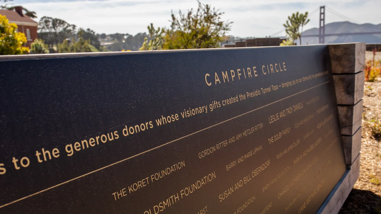 A commemorative plaque at the Tunnel Tops Campfire Circle honors the donors who made the park possible.