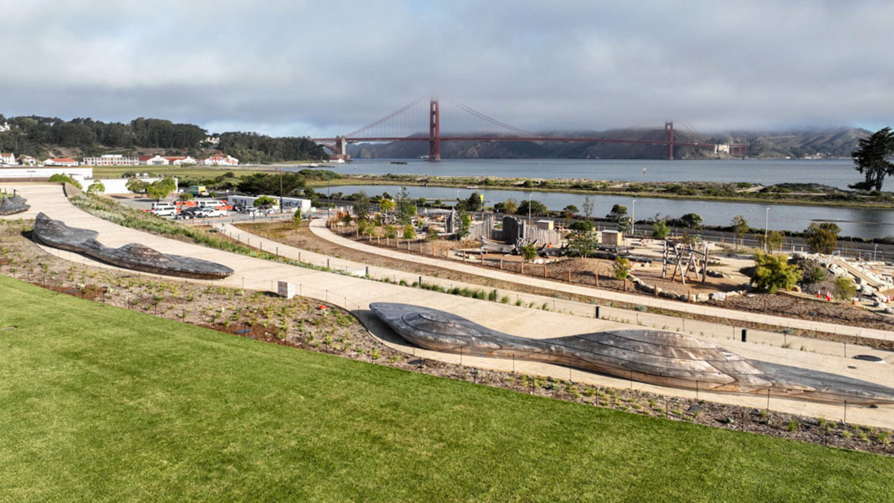 An aerial overlook of the Presidio Tunnel Tops, looking out to the Golden Gate Bridge.