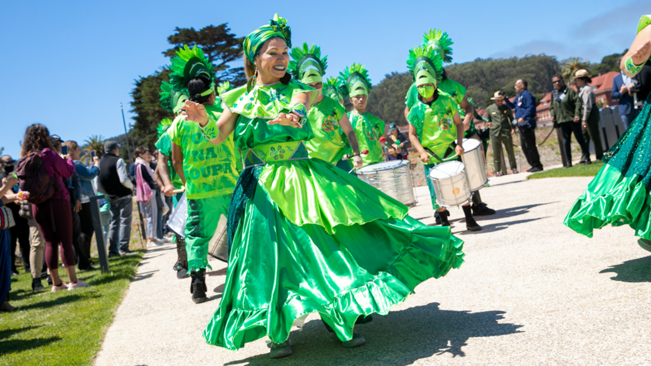 Fogo Na Roupa dancers and band parade throughout the Presidio Tunnel Tops.