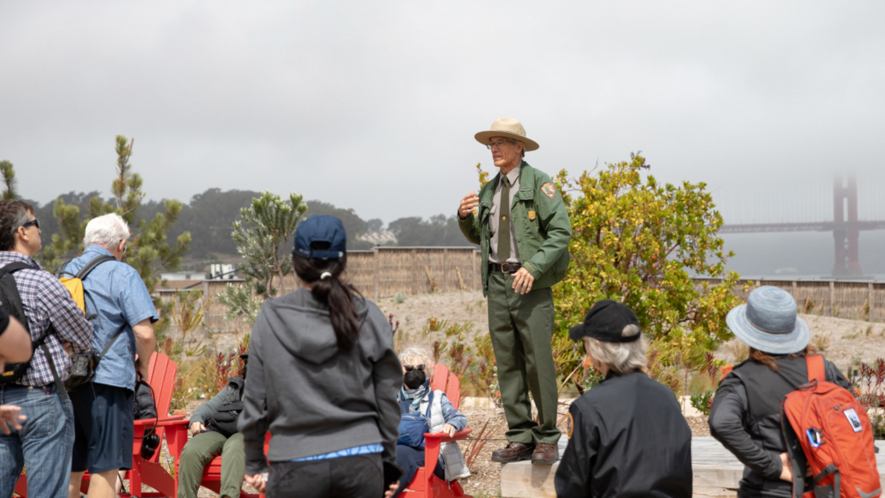 Ranger Talks at Campfire Circle. A Golden Gate National Recreation Area Park Ranger leads a discussion at Presidio Tunnel Tops Campfire Circle.