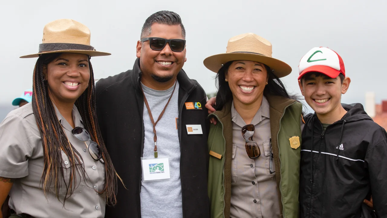 Golden Gate National Recreation Area and Parks Conservancy partners pose for a picture at Presidio Tunnel Tops.