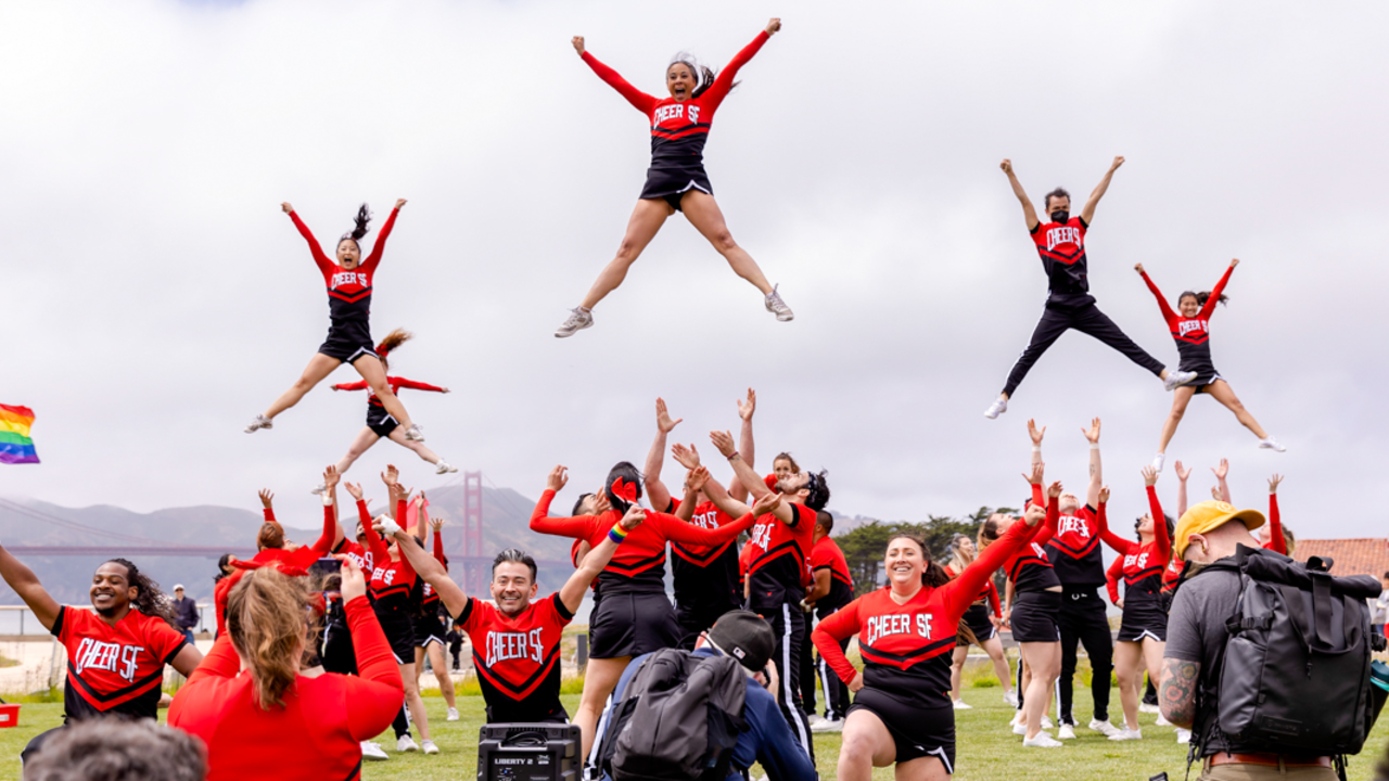 Cheer SF at Fantastic Field Day Cheer SF group performers launch into the air at the Presidio Tunnel Tops